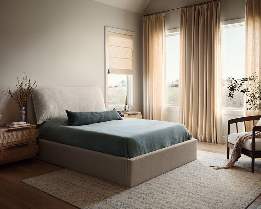 bedroom with stonewashed linen bedding and custom furniture