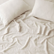 https://www.the-citizenry.com/cdn/shop/files/Stonewashed_Linen_Sheet_Set_Ivory_1.jpg?v=1700090048&width=180