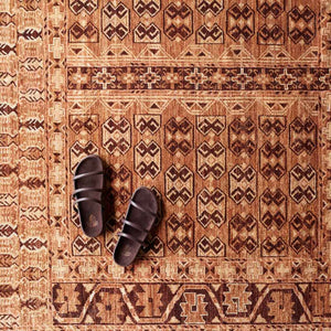 Close up of tobacco rug with motifs, Tobacco