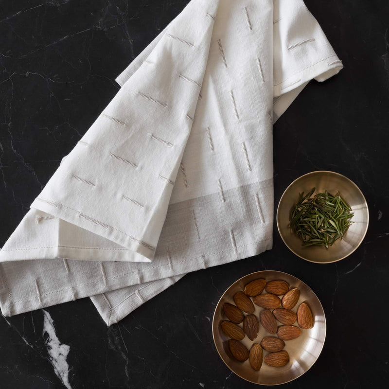 napkin styled with copper bowls, tan