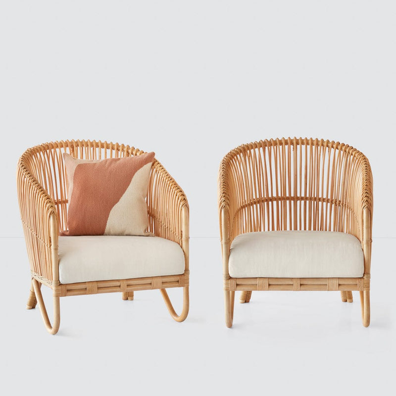 Two rattan lounge chairs side by side, natural