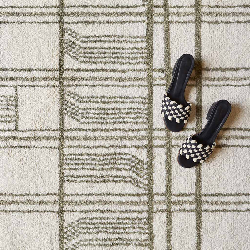 Geometric pattern on Tiya handwoven rug, olive